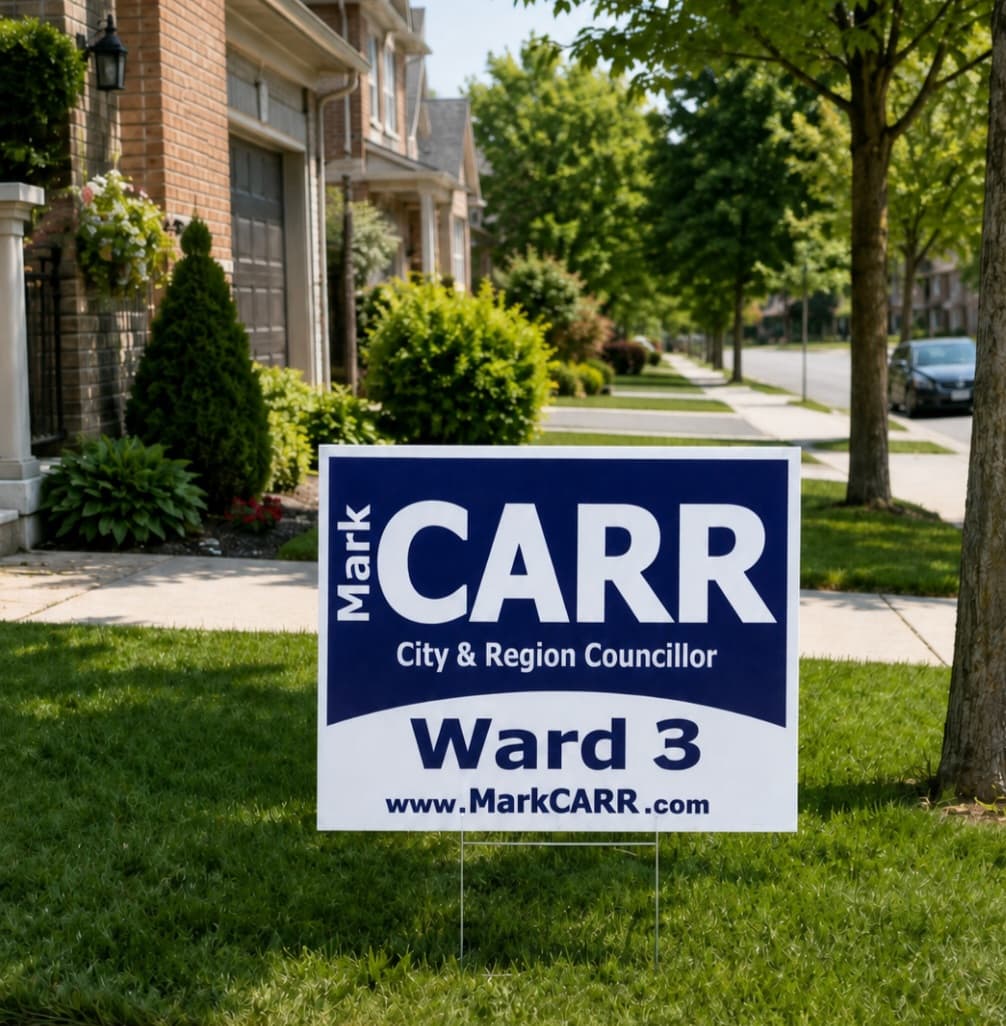 A Mark Carr Ward 3 campaign lawn sign on a Burlington front lawn